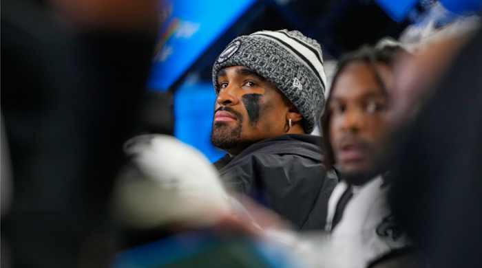 Philadelphia Eagles quarterback Jalen Hurts looks on from the bench during the first half of an NFL football game against the Seattle Seahawks, Monday, Dec. 18, 2023, in Seattle. (AP Photo/Lindsey Wasson)